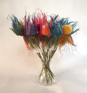 Pompom flowers which will live forever. These large pompoms have been made 4 at a time with Multipom.