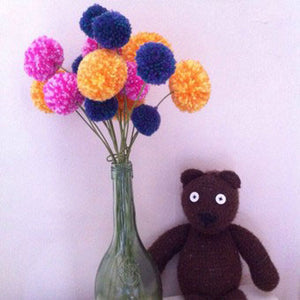 Mr Bean's Ted shows off his bunch of Multipom flowers. Make batches in various colours with your Multipom.