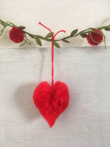 A simple garland with tiny pompoms and heart shaped pompoms.
