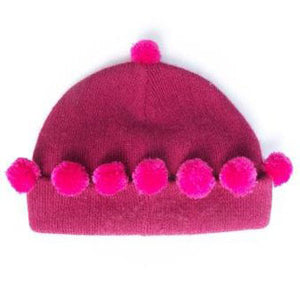 Cute little pink baby pompom hat, made with the Multipom pink starter kit.