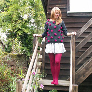 These red fluffy pompoms have been sewn onto this jumper to make a durable comfy piece of clothing which will make you stand out in the crowd.