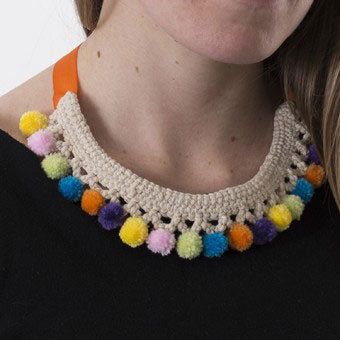 This necklace has been crocheted with a natural cotton. The mini pompoms certainly brighten it up!