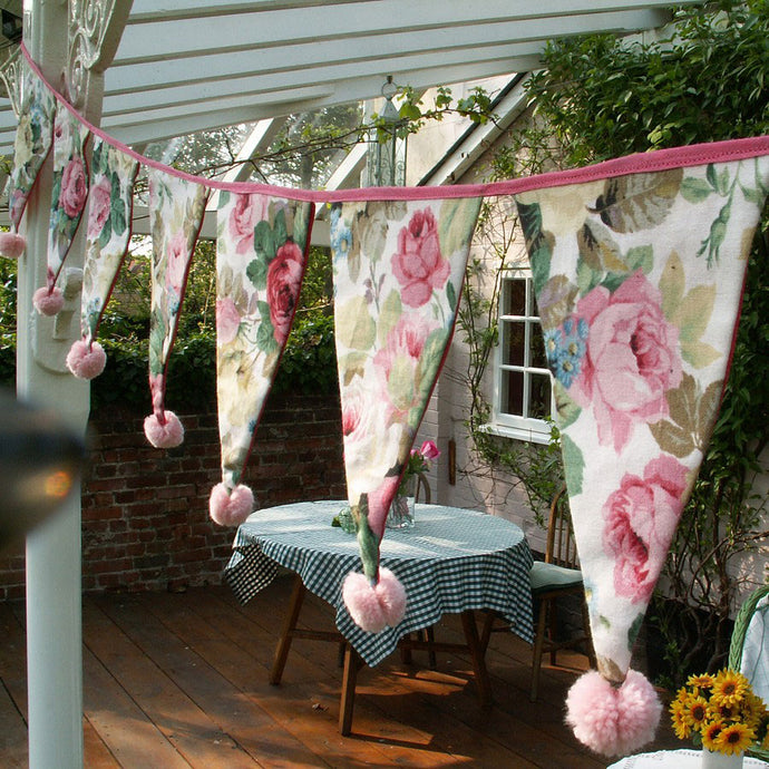 Little pompoms tied to the bottom of each flag enhance this gorgeous summer bunting.
