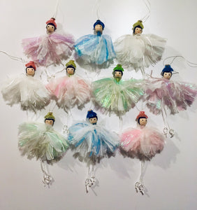 These little fairies are made from pompoms using strips of fabric.. Pompoms can be made from anything that you can wrap around the frame. Instructions to make these are in our project book..