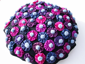 This stunning eye catching cushion is for those 'Suffolk Puff' patchworkers out there! Instructions can be found in our Multipom project book.